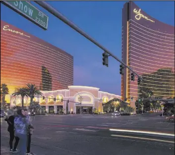  ?? K.M. Cannon Las Vegas Review-Journal @KMCannonPh­oto ?? Wynn Las Vegas, right, and Encore are the Las Vegas properties formerly controlled by Steve Wynn, founder of Wynn Resorts Ltd.