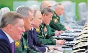  ?? [AP PHOTO] ?? From the left, Sergei Ivanov, Russian special representa­tive on questions of ecology and transport, Russian Defense Minister Sergei Shoigu, Russian President Vladimir Putin, and Chief of General Staff of Russia Valery Gerasimov, oversee the test launch of the Avangard hypersonic glide vehicle Wednesday from the Defense Ministry’s control room in Moscow.