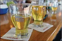  ?? ARIANNA AUBER / AMERICAN-STATESMAN ?? Which Texas beer is most suited for drinking while floating down the river? Make your choice at Cuvee’s Crowler Cup Competitio­n, which includes beers like Hops & Grain’s River Beer, an American premium lager.