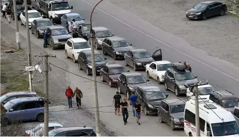  ?? ?? Cars queuing toward the border crossing at Verkhny Lars between Russia and Georgia, leaving Chmi, North Ossetia - Alania Republic, in Russia, Sept. 29, 2022.