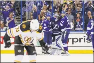  ?? Dirk Shadd / TNS ?? The Tampa Bay Lightning celebrate their 3-1 win over the Bruins in Game 5 on Sunday.