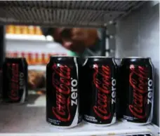  ?? JUAN BARRETO/AFP/GETTY IMAGES ?? Shoppers are increasing­ly turning against the cola and candy blamed for an obesity epidemic in the rich world, due to high sugar content.