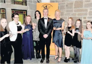  ?? 300317spor­tsaward_12 ?? Winners Some of the female merit winners with Gerry Campbell, general manager of South Lanarkshir­e Leisure