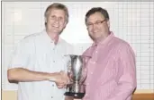  ??  ?? JAN Willem Brinkhorst (right) receives the winners’
trophy from RAHGC secretary Ray Prescott.
