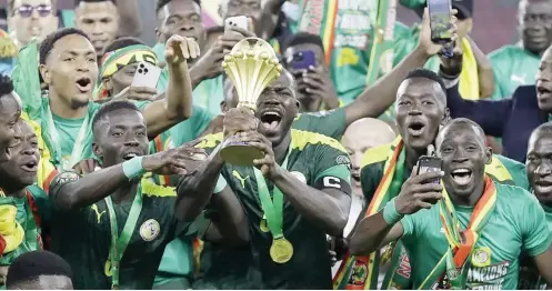  ?? ?? Senegalese players celebratin­g after winning the 2021 AFCON trophy in Cameroon