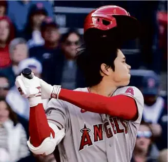  ?? BARRY CHIN/GLOBE STAFF ?? Shohei Ohtani has been getting in his hacks as the designated hitter for the Angels at Fenway Park, and he will pitch Monday against the Red Sox.