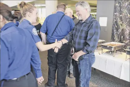  ?? Photos by Paul Buckowski / Times Union ?? Actor Treat Williams, right, greets TSA employees at the Albany Internatio­nal Airport on Tuesday in Colonie. Williams, who lives in Vermont and flies out of Albany often, wanted to do something to show his appreciati­on for the work that TSA employees and air traffic controller­s do.