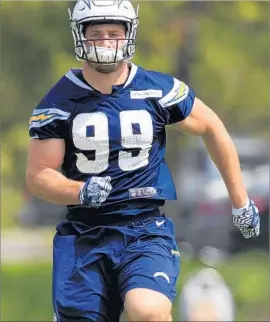  ?? K.C. Alfred San Diego Union-Tribune ?? CHARGERS DEFENSIVE END Joey Bosa joined the team Tuesday for a minicamp day. He will continue to miss team training sessions to work out on his own.