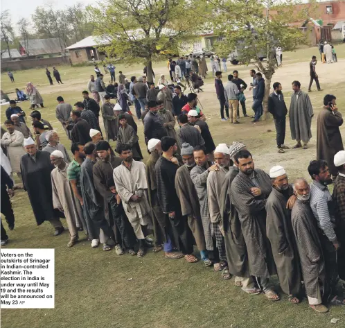  ?? AP ?? Voters on the outskirts of Srinagar in Indian-controlled Kashmir. The election in India is under way until May 19 and the results will be announced on May 23