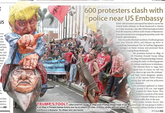  ?? PHOTO BY RUSSELL PALMA ?? TRUMP’S TOOL?
Leftist protesters parade an effigy of US President Doland Trump on top of an effigy of President Rodrigo Duterte near the US Embassy on Friday, to protest alleged American military interferen­ce in Mindanao. The effigies were later burned.