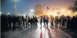  ?? Picture: STR / AFP ?? BIG BROTHER’S WATCHING: Tourists at a flag-raising ceremony at Tiananmen square in Beijing, which 30 years after the Tiananmen crackdown, has seen tanks replaced by countless surveillan­ce cameras.