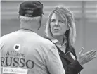  ?? ?? Allison Russo, a Democratic candidate for Ohio’s 15th Congressio­nal District, speaks to a supporter at a campaign block party in Pickeringt­on on Sept. 25.