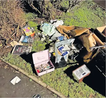  ?? ?? Disgrace Rubbish was strewn across the path