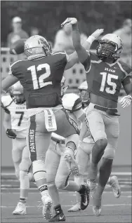  ?? Bud Sullins/Special to Siloam Sunday ?? Siloam Springs seniors Chase Chandler, No. 12, and Primo Agbehi celebrate after the Maroon team made a defensive stop in the first half of the Panthers’ spring game on Tuesday at Panther Stadium.