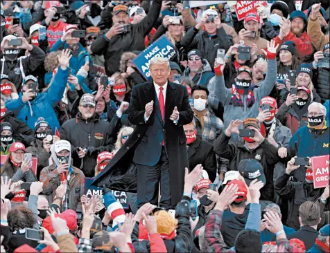  ?? CARLOS OSORIO/AP ?? President Trump arrives at a campaign rally Saturday in Norton Shores, Michigan, a state that may be slipping from him.