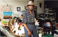  ?? Francesca Andre / For Hearst Connecticu­t Media ?? Adger Cowans, a fine arts photograph­er and abstract painter, poses for a portrait in his home in Bridgeport on July 28, 2018.