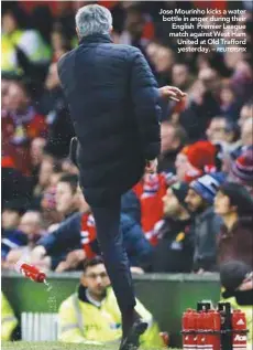  ??  ?? Jose Mourinho kicks a water bottle in anger during their English Premier League match against West Ham United at Old Trafford yesterday. –