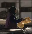  ?? DIEGO IBARRA SANCHEZ — THE NEW YORK TIMES ?? A Kurdish woman works in a Syrian bread factory. Dozens of countries have put up trade barriers to protect scarce supplies of food and commoditie­s.