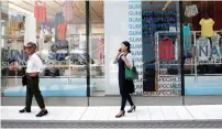  ?? Reuters ?? A shopping district in Tokyo on Friday. Consumptio­n in Japan ‘isn’t strong so companies are struggling to raise prices’. —