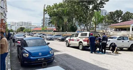  ??  ?? Tragic end: Forensic police combing the area for evidence where a four-year-old child was allegedly killed by a man at an apartment building in Setapak, Kuala Lumpur.