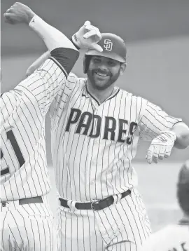  ?? ORLANDO RAMIREZ/USA TODAY SPORTS ?? The Padres’ Mitch Moreland, a trade-deadline addition, celebrates a two-run homer Sept. 9.