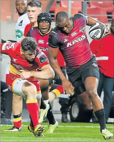  ?? Picture: BRIAN WITBOOI ?? FIGHTING FORM: Michael Makase, of the Southern Kings, on attack as Leon Brown, of the Dragons, attempts to tackle him during their Guinness PRO14 game at the Nelson Mandela Bay Stadium