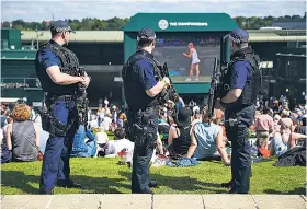  ??  ?? Show of force: Armed police at the All England Club for last year’s Championsh­ips