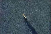  ?? PLANET LABS PBC ?? In this satellite image provided by Planet Labs, the Belize-flagged bulk carrier Rubymar is seen Feb. 20 in the southern Red Sea near the Bay el-Mandeb Strait leaking oil after an attack by Yemen’s Houthi rebels.