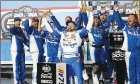  ?? Associated Press ?? Ricky Stenhouse Jr. (center) celebrates in Victory Lane after winning the NASCAR Daytona 500 race at Daytona Internatio­nal Speedway, Sunday, in Daytona Beach, Fla. It was Stenhouse’s first win after a drought in 199 races.