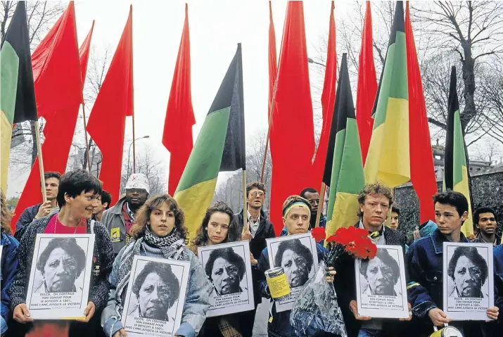  ?? Picture: GETTY IMAGES ?? EN MARCHE: After Dulcie September’s murder in Paris in 1988, more than 20 000 Parisians marched to mourn her, many carrying posters reading ‘Dulcie was our friend’