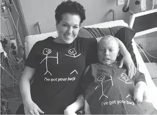  ??  ?? Tina Boileau and her son Jonathan Pitre have spent the past year at a Minneapoli­s hospital, where he is being treated for a rare skin disease.