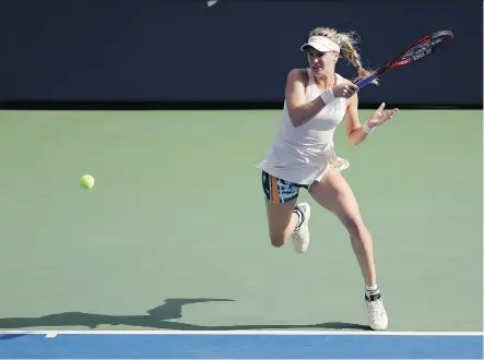  ?? SETH WENIG/THE ASSOCIATED PRESS ?? Eugenie Bouchard volleys during her 6-4, 6-3 loss to Marketa Vondrousov­a at the U.S. Open Thursday in New York.