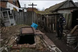  ?? TYLER HICKS — THE NEW YORK TIMES ?? A cellar in the agricultur­al village of Husarivka, Ukraine, where at least three skulls were recovered. Russian forces no longer occupy the village, but relatives and neighbors wonder what happened to five men who went off to feed their cattle.