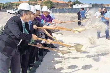  ?? BRIAN BALLOU/STAFF ?? Several local, county and state elected officials break ground on Pembroke Pines’ new civic center on Monday.