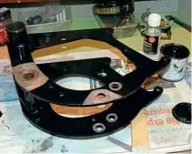  ??  ?? Left: Rear engine mount: removing powder coat from critical areas. The final step was to apply a thin coat of paint to protect the bare metal. This is a vital component carrying as it does the gearbox, crankcase, rear suspension, centrestan­d and, effectivel­y, the rear wheel