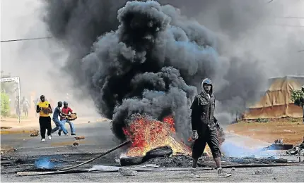  ?? / ALON SKUY/ THE TIMES ?? Bekkersdal residents barricade roads during a service delivery protest last month. It is hoped the creation of the new Rand West City municipali­ty will solve such issues .