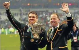  ?? /Tertius Pickard /Gallo Images ?? Leaders of men: Springbok captain John Smit and coach Jake White with the Webb Ellis Cup after the Boks beat the best in the world in 2007.