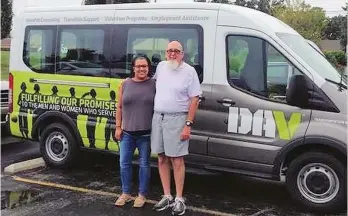  ?? (Special to The Commercial/Michael Dobbs) ?? Breanna Wilson, voluntary service specialist, and driver Mac McEntire at the Disabled American Veterans National Headquarte­rs at Cold Springs, Ky., pick up a van donated by the Pine Bluff Disabled American Veterans for the Pine Bluff Volunteer Transporta­tion Route.