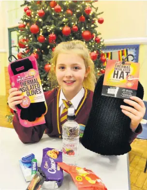  ?? Picture: Steve Bould ?? HEART OF GOLD: Madison Hall-elliott with some of the items she has collected for homeless people over the festive period.