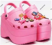  ??  ?? Height of kitsch? A pair of pink Balenciaga platform Crocs