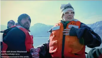  ??  ?? A film still shows Westwood and Kronthaler on a Greenpeace boat in the arctic.