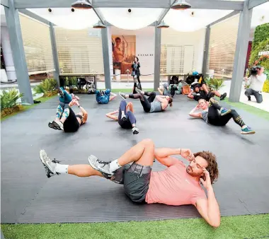  ??  ?? Joe leading abdominal exercises. Photot: PA Photo/John Carey