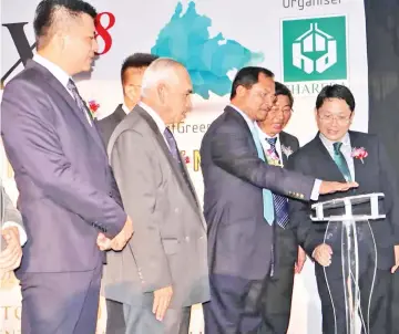  ??  ?? Jaujan launching the Propex 2018 at Sabah Trade Centre yesterday. Also seen are Yusof (second left) and Chew (second right).