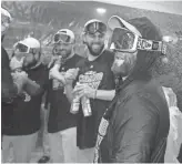  ?? GETTY IMAGES ?? Dustin Pedroia celebrates with his Red Sox teammates after they defeated the Yankees in Game 4 of the ALDS on Oct. 9.