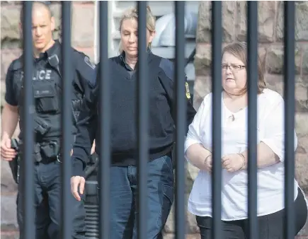  ??  ?? Elizabeth Wettlaufer is escorted from the provincial courthouse in Woodstock, Ont., on Thursday, where she admitted Thursday to using insulin to kill eight seniors and hurt six others.