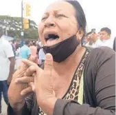  ?? JOSE SANCHEZ/AP ?? A relative of an inmate in the Litoral Penitentia­ry demands informatio­n Saturday about the gun battle inside the jail in Guayaquil, Ecuador, which left 68 dead.