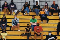  ?? JOSE CARLOS FAJARDO — STAFF PHOTOGRAPH­ER ?? Parents wear masks and social distance as they watch Dublin play Archbishop Mitty during their game at Dublin High School on May 13.