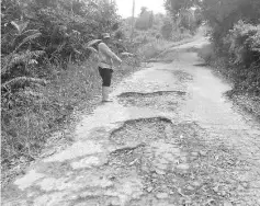  ??  ?? Villagers in Kampung Ketiau urged the relevant authority to repair and upgrade the damaged road.