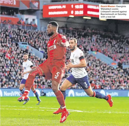  ??  ?? Dutch Master: Georginio Wijnaldum scores Liverpool’s second against Bournemout­h on Saturday with a neat lob