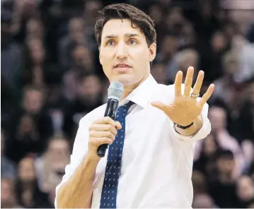  ?? NATHAN DENETTE / THE CANADIAN PRESS ?? Prime Minister Justin Trudeau, speaking in Hamilton on Wednesday, said religious groups should not be swayed from applying to the Canada Summer Jobs program, despite a new clause that refers to “reproducti­ve rights.”